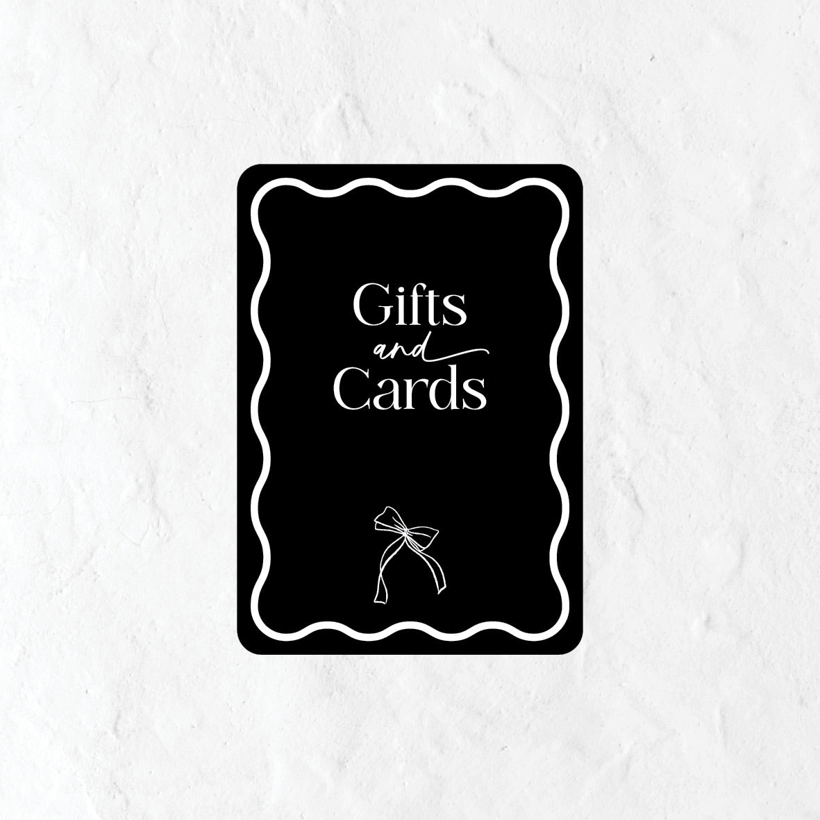 Black and white gifts and cards sign with a bow icon