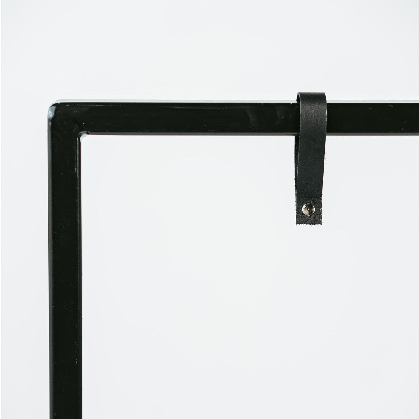 Black metal signage frame with black leather straps