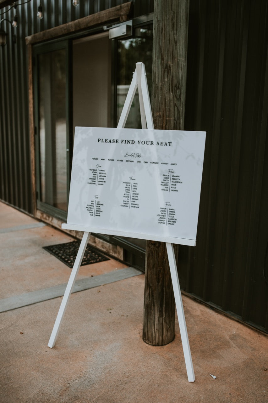 Easel with seating plan sign outdoors at the Lookout Lodge Wanaka