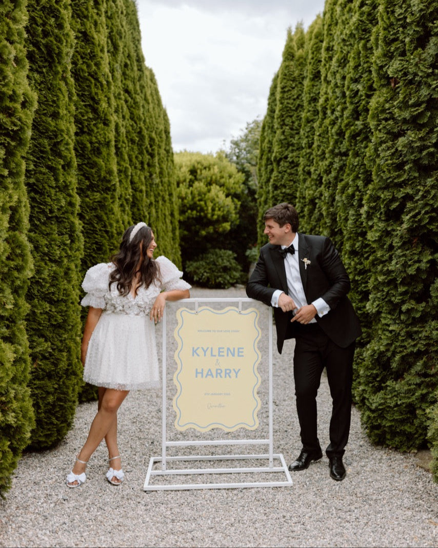 Kylene and Harry with their welcome sign at the Winehouse in Queenstown