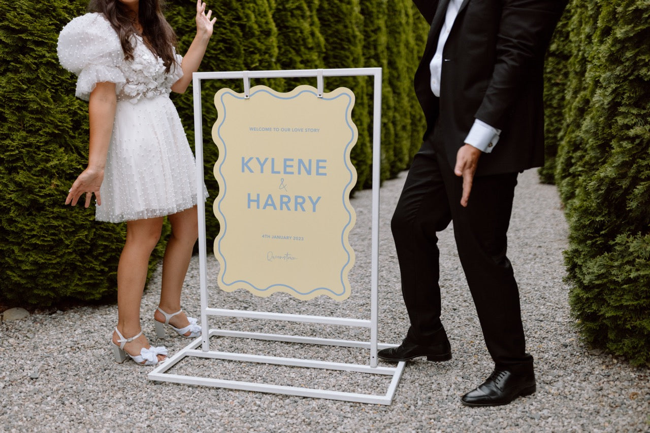 Kylene and Harry with their welcome sign at the Winehouse in Queenstown