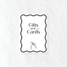 Black and white Gifts and Cards sign and a bow illustration 