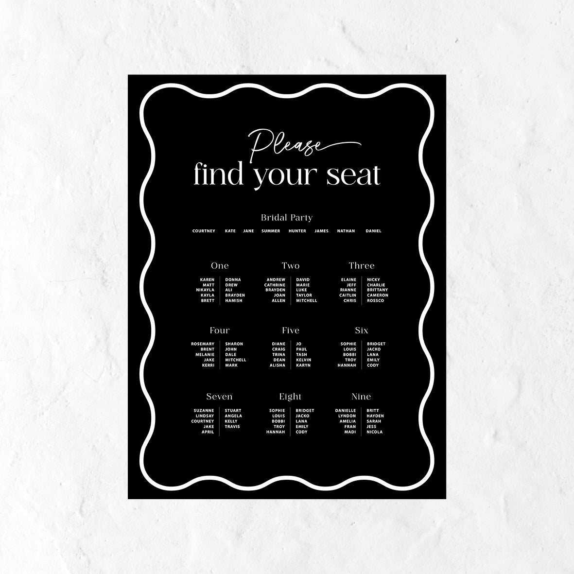 Black and white seating plan for a wedding on a textured white background
