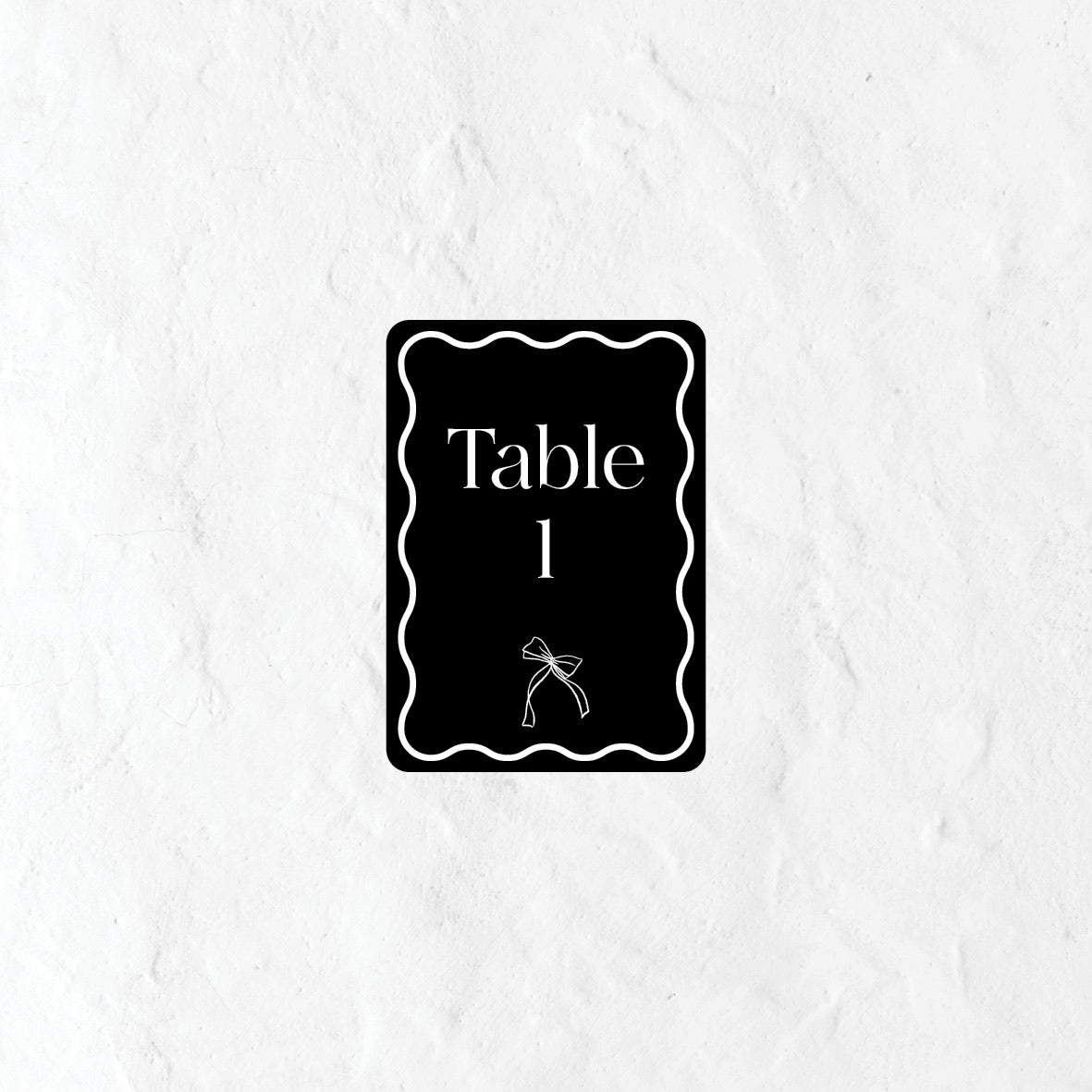 Black and white table number with 'Table 1' text on a textured white background