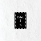 Black and white table number with 'Table 1' text on a textured white background