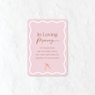 Pink In Loving Memory sign on a white background