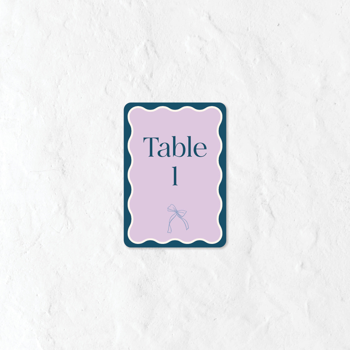 Table number sign in a pastel blue and purple palette