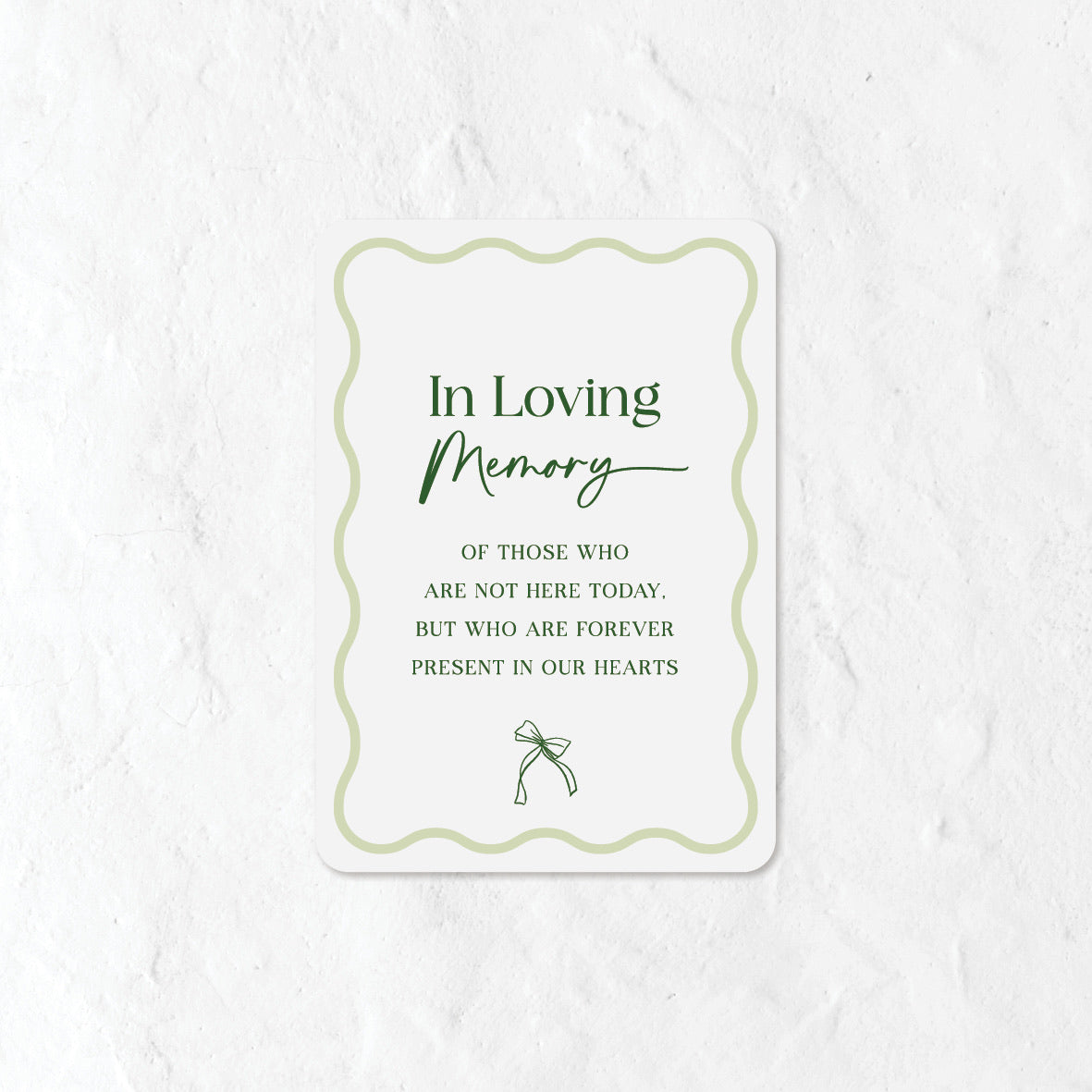 In Loving Memory sign with a green colour palette and a bow icon 