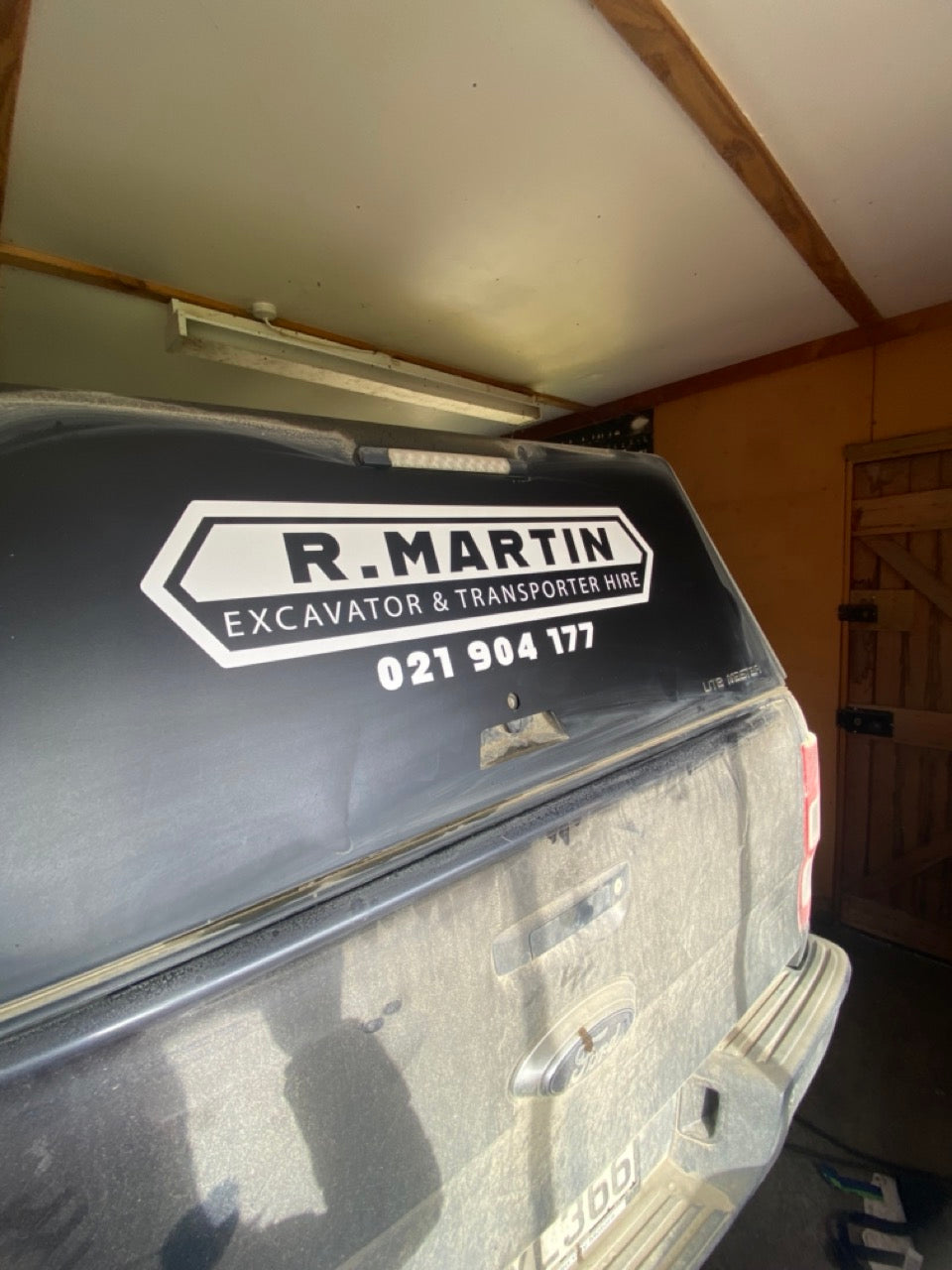 R.Martin logo vehicle decal on canopy of ute