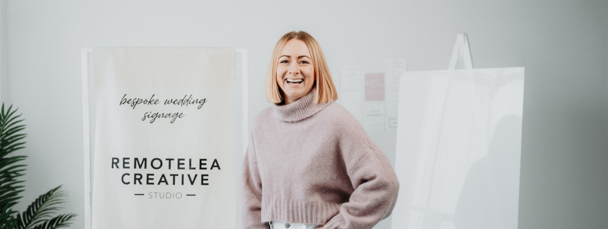 Remotelea Creative styled shoot Leanne standing with Fabric Remotelea Creative sign