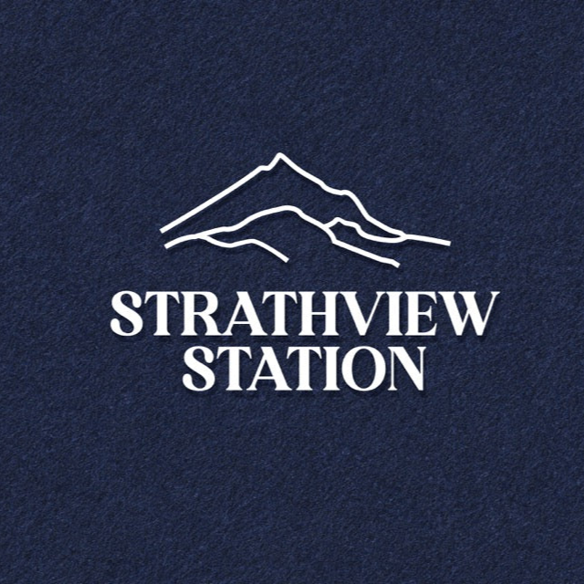 Strathview Station logo with mountain silhouette on a dark blue background