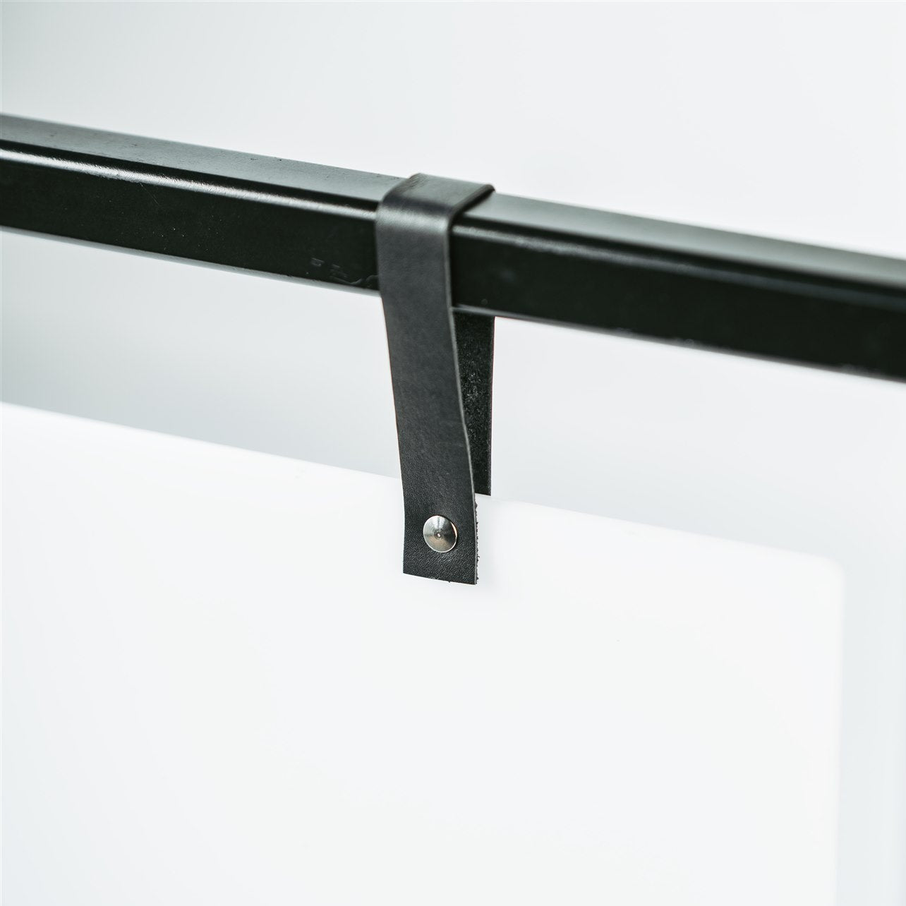 Black metal signage frame with black leather hanging strap