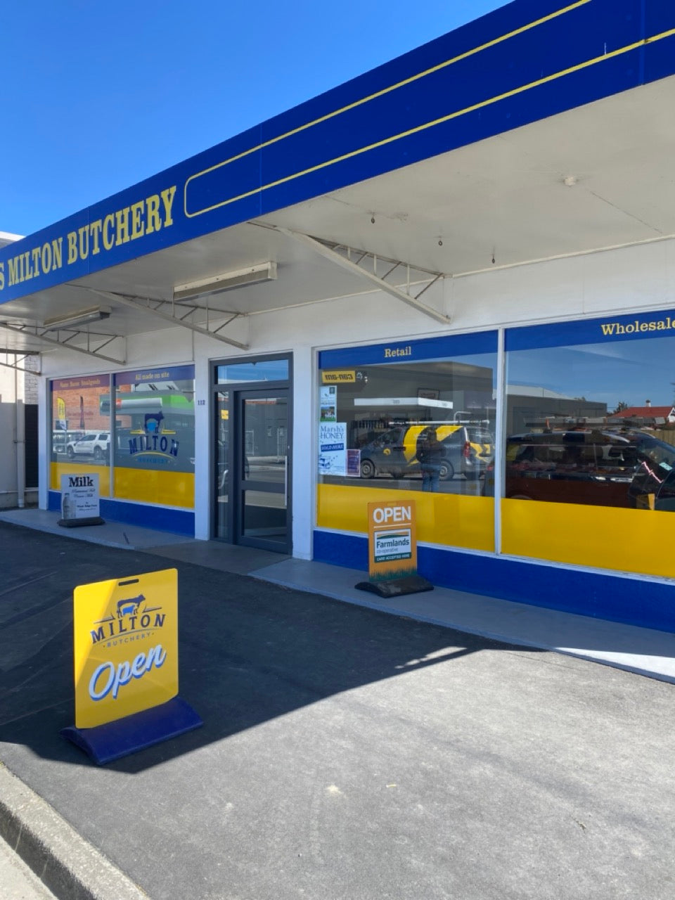 Milton Butchery store front with blue and yellow branding